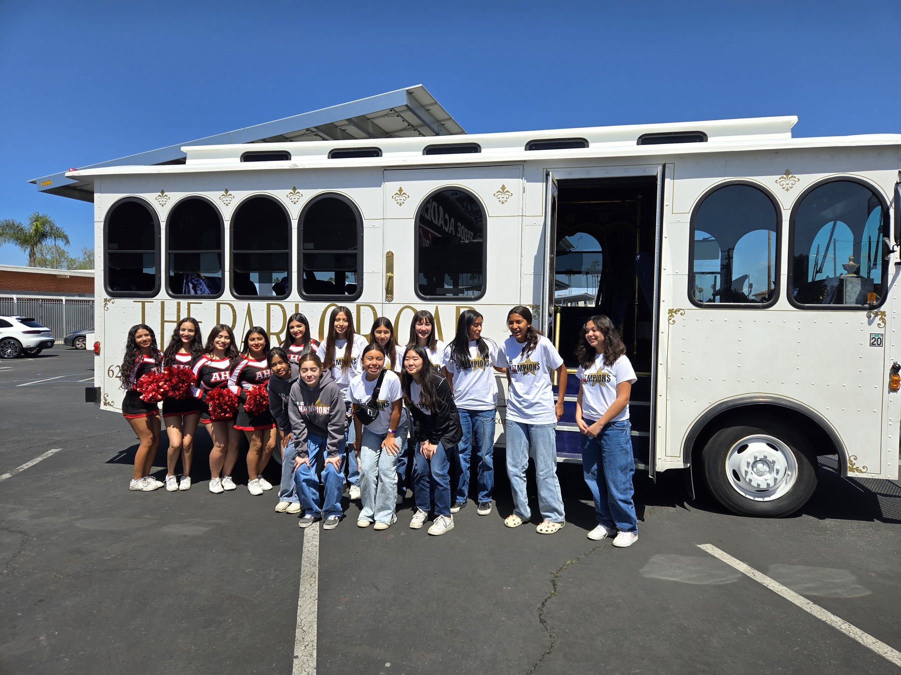 High school seniors posing with The Parlor Car trolley in Los Angeles