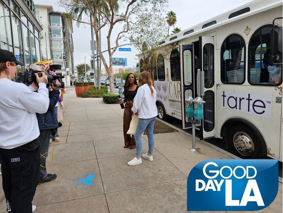 Good Day LA filming the trolley wrapped for Tarte Cosmetics