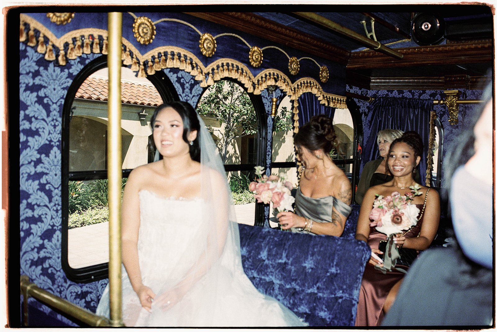 Bride and wedding party riding inside The Parlor Car trolley